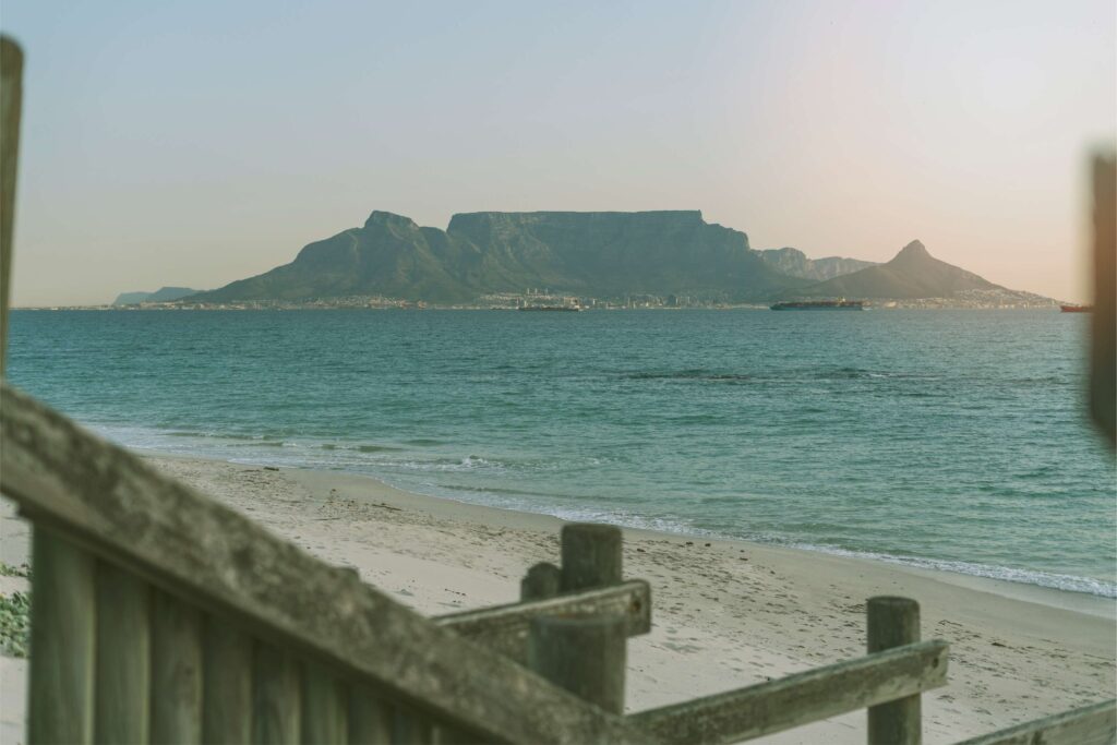 Scenic view of Table Mountain from a Cape Town beach, representing DNA EOR’s local presence and South Africa's evolving parental leave rules.