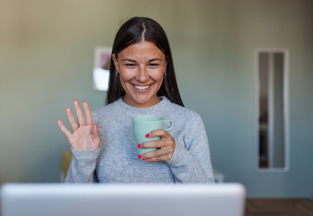 South African remote worker collaborating online with a UK employer, EOR services provided by DNA EOR. A friendly South African professional on a video call with a UK employer, representing compliant and collaborative remote work.